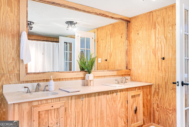 709 Tallapoosa Hwy, Cedartown, GA 30125 - bathroom with double vanity, a sink, and wooden walls