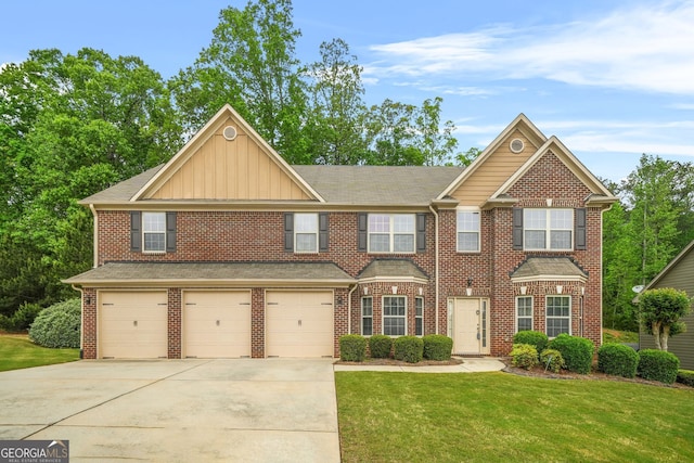 4616 Town Manor Dr, Douglasville, GA 30135 - view of front of home with brick siding, a garage, board and batten siding, a front yard, and concrete driveway