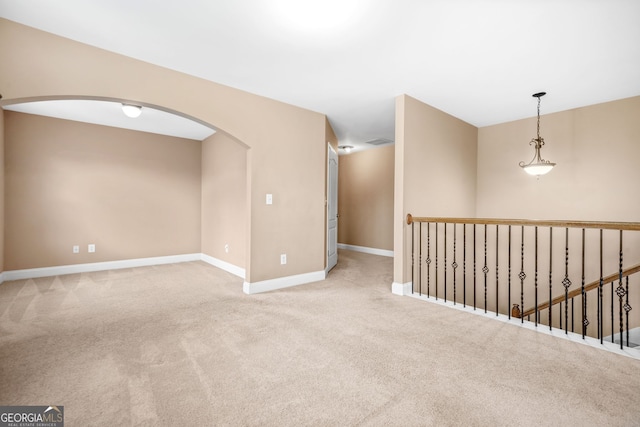 4616 Town Manor Dr, Douglasville, GA 30135 - spare room featuring arched walkways, baseboards, visible vents, and carpet