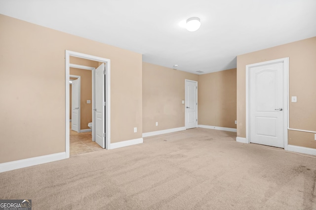 4616 Town Manor Dr, Douglasville, GA 30135 - unfurnished bedroom featuring carpet flooring, baseboards, and ensuite bath