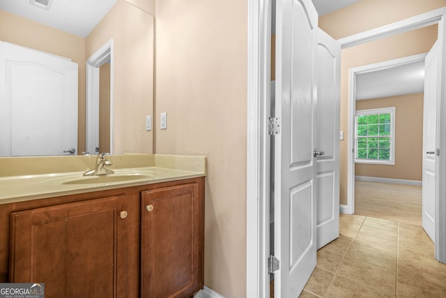 4616 Town Manor Dr, Douglasville, GA 30135 - bathroom with vanity, baseboards, tile patterned flooring, and visible vents