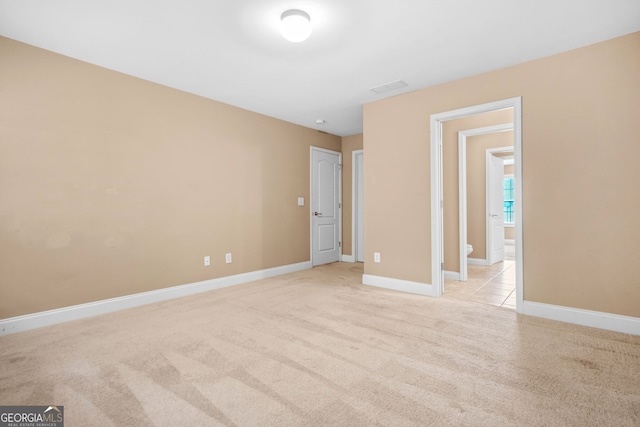 4616 Town Manor Dr, Douglasville, GA 30135 - unfurnished bedroom with baseboards and light colored carpet