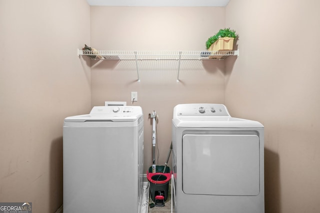 4616 Town Manor Dr, Douglasville, GA 30135 - clothes washing area featuring separate washer and dryer and laundry area