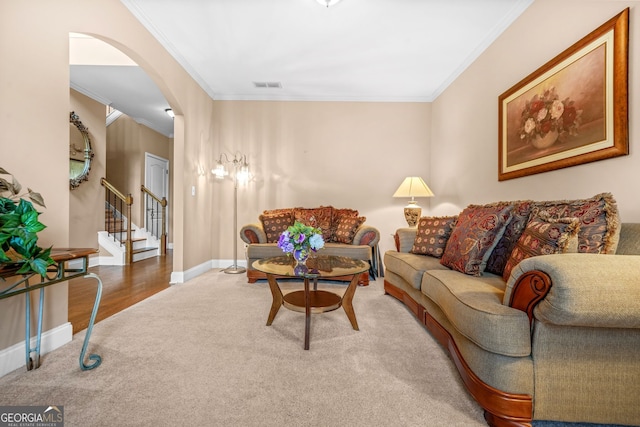 4616 Town Manor Dr, Douglasville, GA 30135 - living area with stairs, arched walkways, ornamental molding, and carpet
