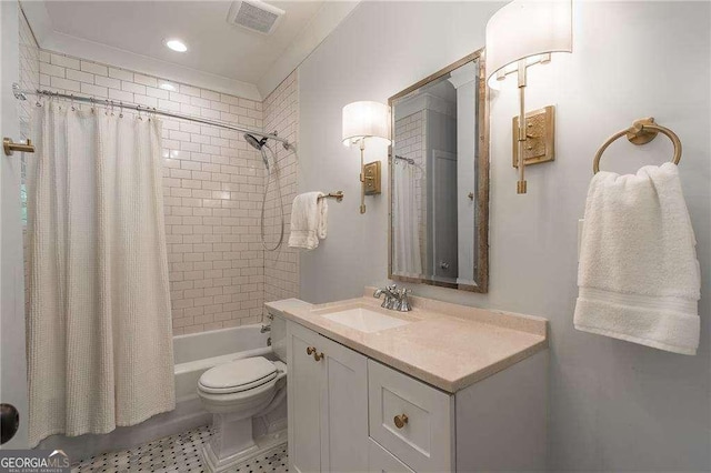 full bath with visible vents, tile patterned flooring, shower / bath combo with shower curtain, vanity, and toilet