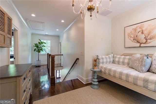 living room featuring attic access, dark wood-style flooring, crown molding, baseboards, and recessed lighting