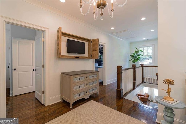 hall with baseboards, recessed lighting, wood finished floors, and an upstairs landing