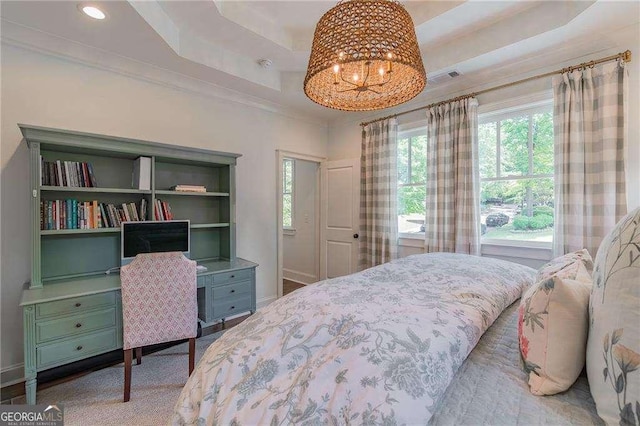 bedroom with an inviting chandelier, a raised ceiling, crown molding, and baseboards
