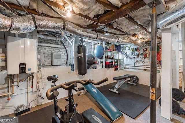 exercise area featuring water heater