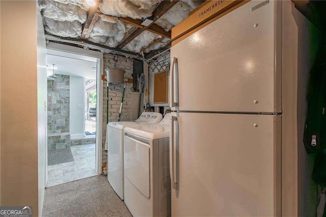 washroom with laundry area and washing machine and dryer