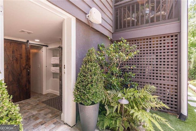 view of exterior entry featuring visible vents