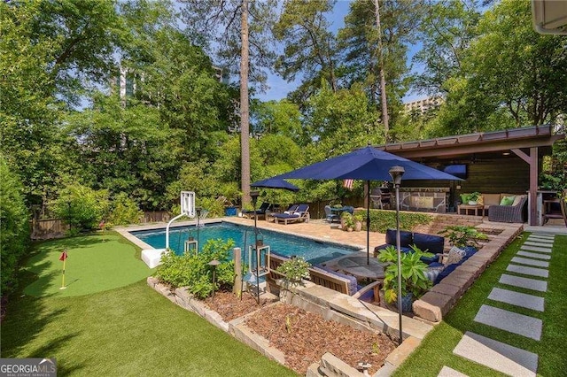 outdoor pool with an outdoor living space, a fenced backyard, and a patio area