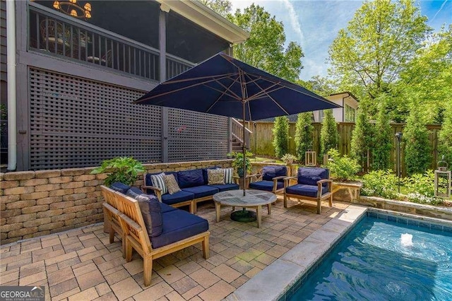 view of patio with a fenced backyard, outdoor lounge area, and an outdoor pool