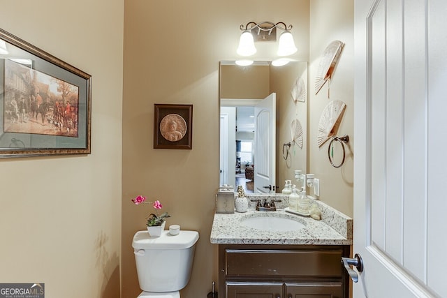 55 Sudderth St, Buford, GA 30518 - half bathroom featuring vanity and toilet