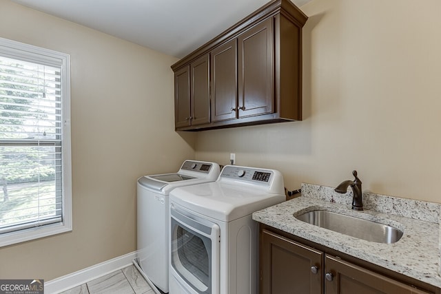 55 Sudderth St, Buford, GA 30518 - laundry room with marble finish floor, baseboards, a sink, cabinet space, and independent washer and dryer