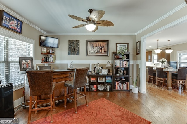 55 Sudderth St, Buford, GA 30518 - bar featuring ceiling fan, bar, wood finished floors, and ornamental molding
