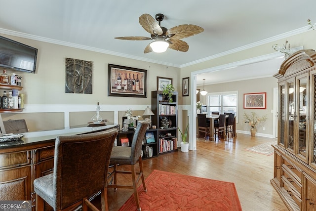55 Sudderth St, Buford, GA 30518 - dining area with crown molding, a ceiling fan, baseboards, and wood finished floors