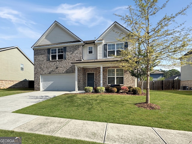 376 Layfield Dr, Jonesboro, GA 30238 - view of front of house with fence, a front yard, brick siding, an attached garage, and driveway