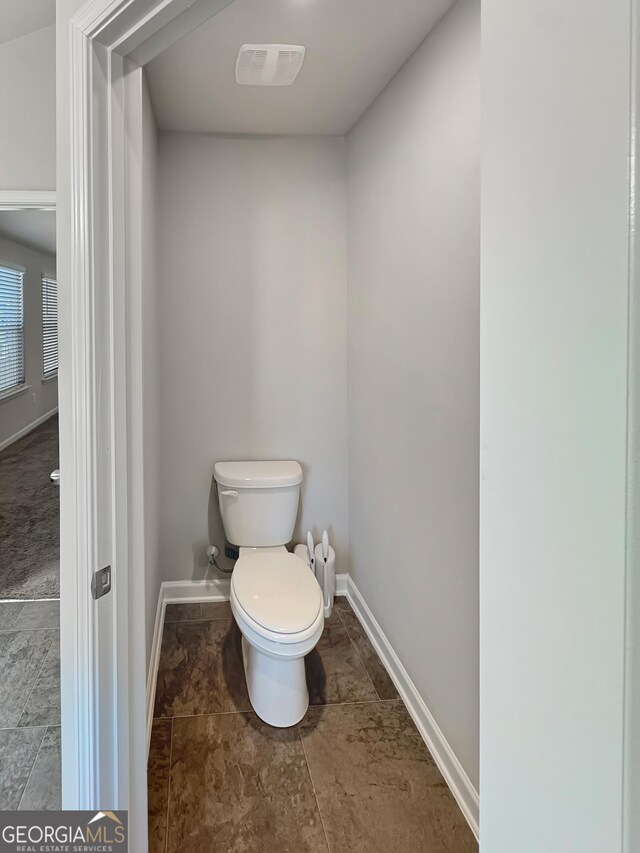 376 Layfield Dr, Jonesboro, GA 30238 - bathroom featuring baseboards, visible vents, and toilet