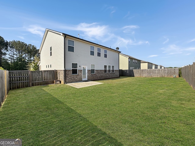376 Layfield Dr, Jonesboro, GA 30238 - rear view of house featuring a lawn, a fenced backyard, a patio area, and brick siding