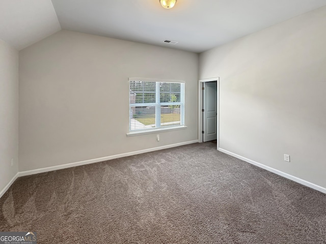 376 Layfield Dr, Jonesboro, GA 30238 - carpeted spare room featuring baseboards, visible vents, and vaulted ceiling