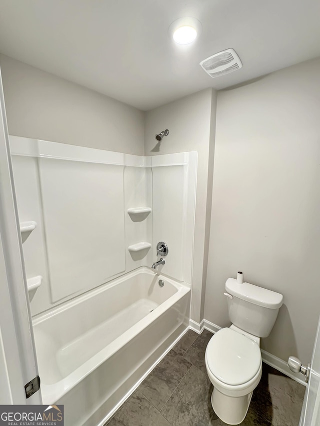 376 Layfield Dr, Jonesboro, GA 30238 - full bathroom featuring visible vents, baseboards, washtub / shower combination, and toilet