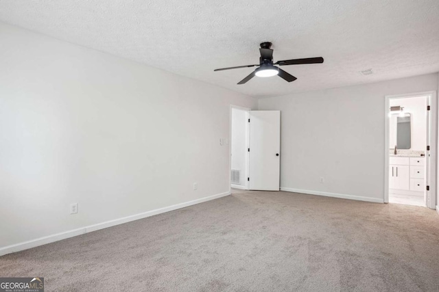 3688 Burnley Ct, Lithonia, GA 30038 - unfurnished bedroom with carpet floors, visible vents, baseboards, ensuite bathroom, and a textured ceiling