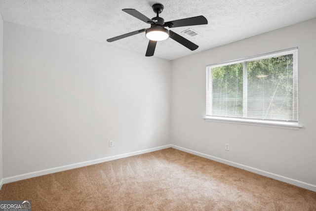 3688 Burnley Ct, Lithonia, GA 30038 - unfurnished room with baseboards, carpet flooring, a textured ceiling, and ceiling fan
