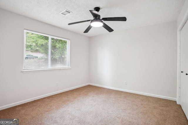 3688 Burnley Ct, Lithonia, GA 30038 - unfurnished bedroom featuring visible vents, baseboards, ceiling fan, a textured ceiling, and carpet