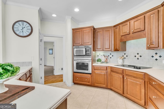 5303 Davenport Mnr, Cumming, GA 30041 - kitchen featuring brown cabinetry, backsplash, light tile patterned floors, ornamental molding, and stainless steel appliances