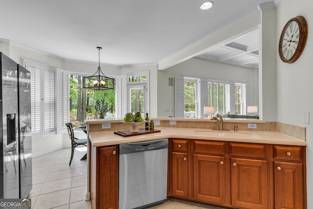 5303 Davenport Mnr, Cumming, GA 30041 - kitchen with appliances with stainless steel finishes, a sink, light countertops, an inviting chandelier, and light tile patterned flooring