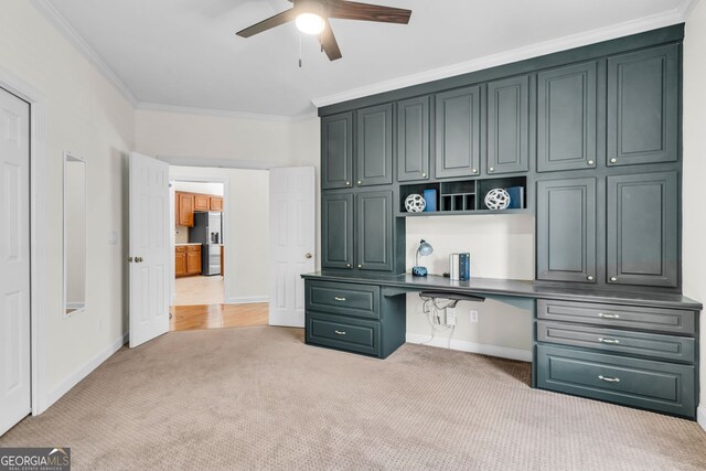 5303 Davenport Mnr, Cumming, GA 30041 - unfurnished office featuring a ceiling fan, light colored carpet, crown molding, built in study area, and baseboards