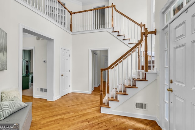 5303 Davenport Mnr, Cumming, GA 30041 - foyer entrance featuring baseboards, stairs, wood finished floors, and visible vents