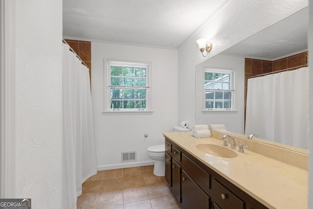 full bathroom featuring toilet, vanity, tile patterned floors, baseboards, and a shower with shower curtain