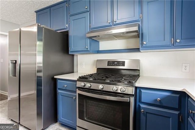 848 E Ave, Scottdale, GA 30079 - kitchen with stainless steel appliances, blue cabinets, and under cabinet range hood