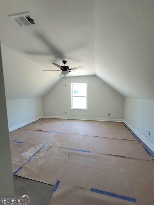 bonus room featuring visible vents, baseboards, ceiling fan, and vaulted ceiling