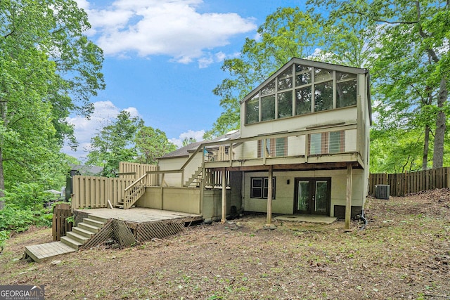 1213 Laurel Cliff Dr SE, Smyrna, GA 30082 - back of house featuring fence, a deck, french doors, central AC unit, and stairway