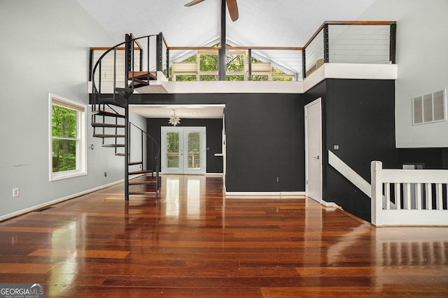 1213 Laurel Cliff Dr SE, Smyrna, GA 30082 - unfurnished living room featuring visible vents, stairway, high vaulted ceiling, and hardwood / wood-style flooring
