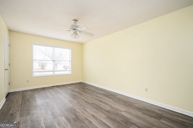 4157 Lake Mist Dr NW, Kennesaw, GA 30144 - spare room featuring baseboards, ceiling fan, and dark wood-style floors