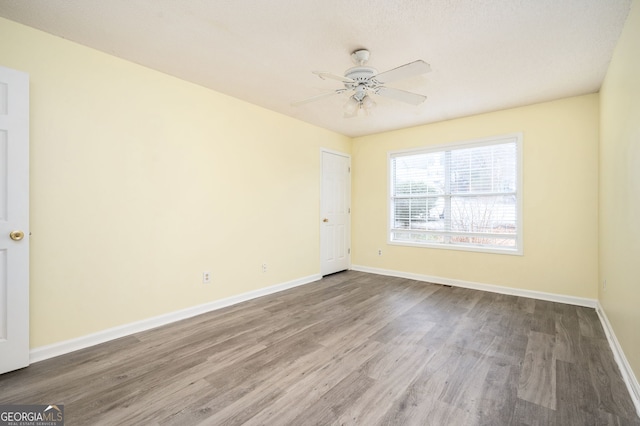 4157 Lake Mist Dr NW, Kennesaw, GA 30144 - spare room with baseboards, ceiling fan, and wood finished floors