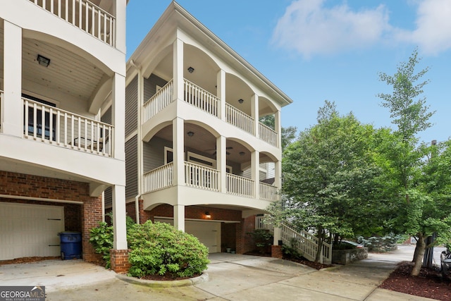 737 St Charles Ave NE, Atlanta, GA 30306 - view of building exterior with concrete driveway and a garage