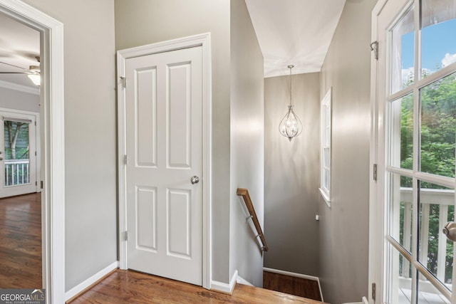 737 St Charles Ave NE, Atlanta, GA 30306 - stairway featuring wood finished floors, baseboards, ceiling fan, and crown molding