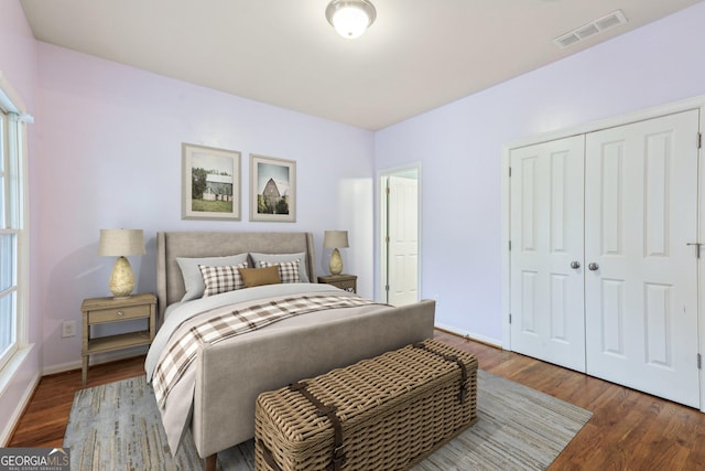 737 St Charles Ave NE, Atlanta, GA 30306 - bedroom featuring wood finished floors, baseboards, and a closet