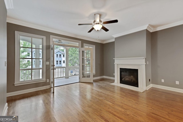 737 St Charles Ave NE, Atlanta, GA 30306 - unfurnished living room featuring ceiling fan, wood finished floors, baseboards, ornamental molding, and a premium fireplace