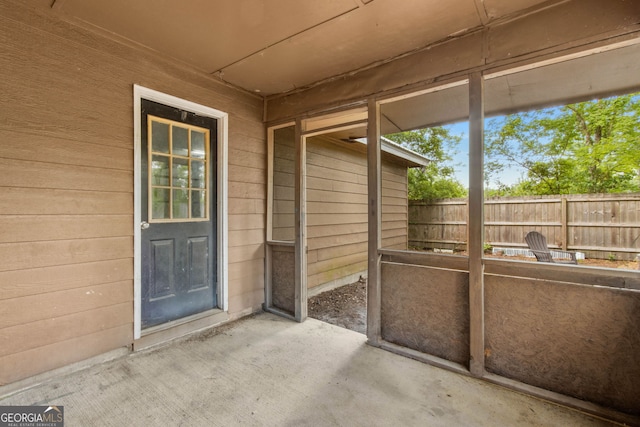 unfurnished sunroom featuring a wealth of natural light