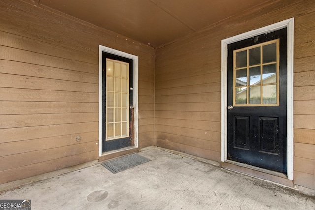 property entrance featuring a patio area