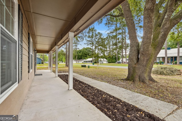 view of patio / terrace with a porch and a residential view