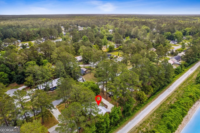 bird's eye view featuring a forest view