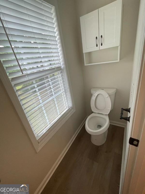 laundry area featuring visible vents, laundry area, wood finished floors, a textured ceiling, and hookup for an electric dryer