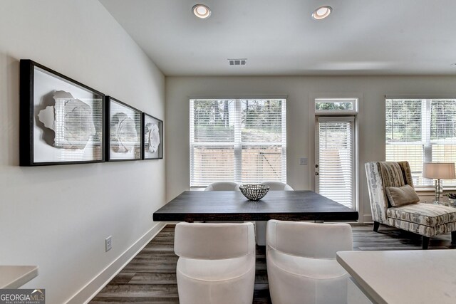 dining space with visible vents, recessed lighting, dark wood finished floors, and baseboards